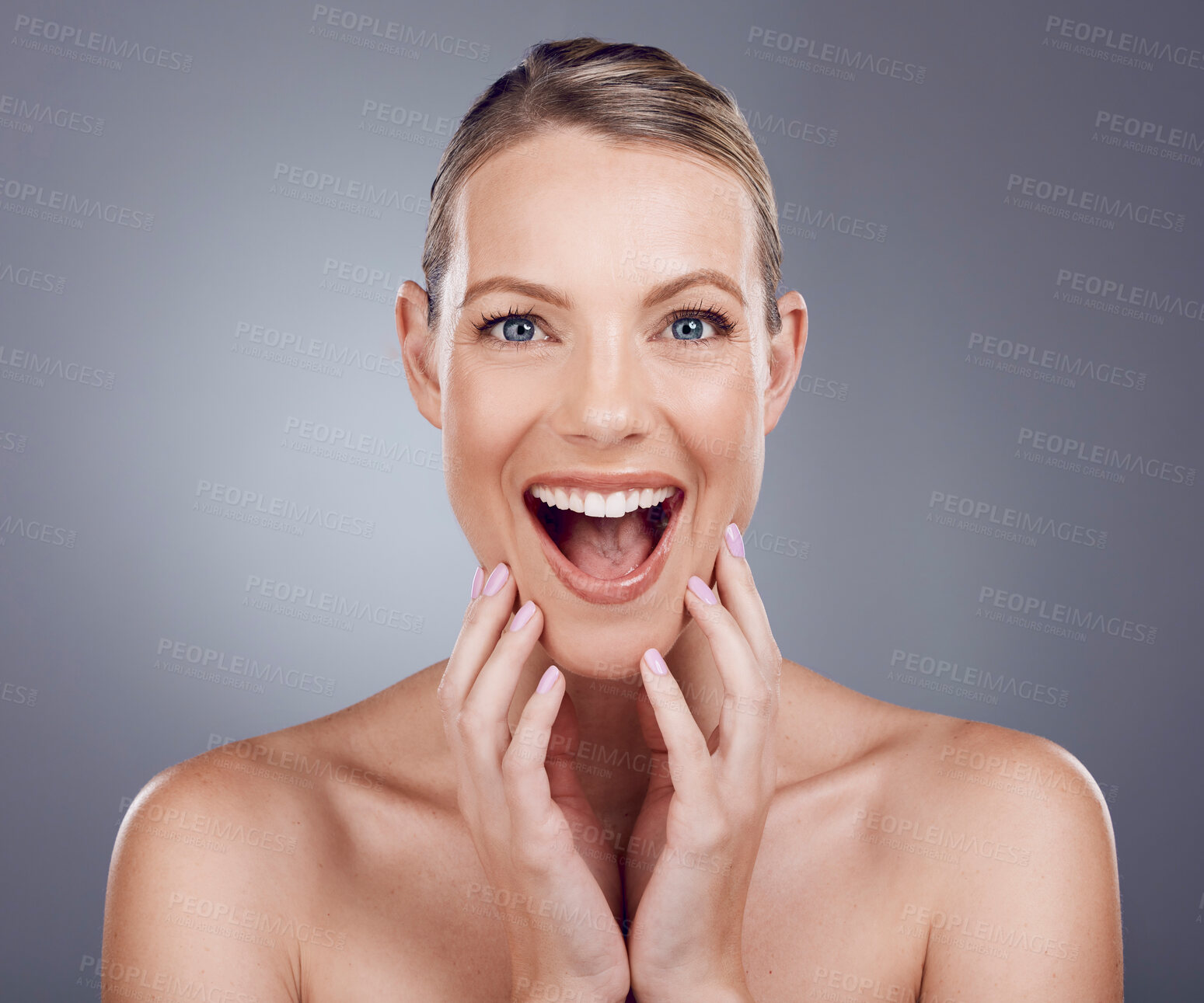 Buy stock photo Wow, beauty and skincare with face of woman for facial, cosmetics and spa treatment. Surprised, dermatology and wellness with model and glow for self care, clean and makeup in gray studio background