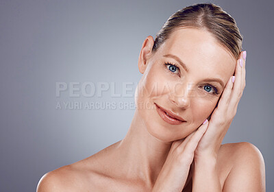 Buy stock photo Beauty, face and woman in portrait with hands, facial with dermatology and skincare on studio background. Cosmetic care, mockup space and healthy skin with smile, natural cosmetics and wellness