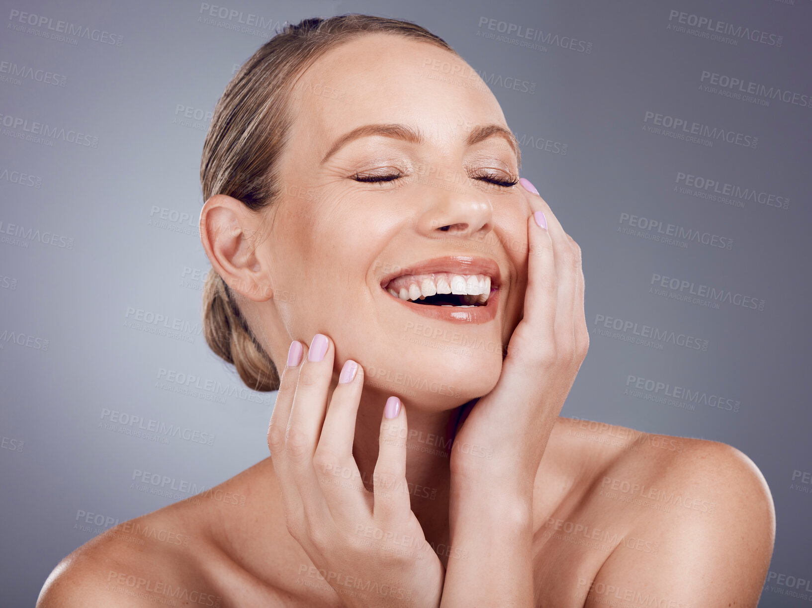 Buy stock photo Beauty, woman and laughing in studio for skincare, laser dermatology and wellness cosmetics on background. Happy female model touch face for aesthetic glow, shine and healthy facial transformation 