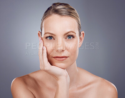 Buy stock photo Beauty, face and woman in portrait, skin with hand and facial, dermatology and skincare on studio background. Cosmetic care, model and healthy glow, natural cosmetics and wellness with cosmetology