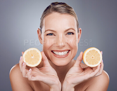 Buy stock photo Lemon skincare, woman and beauty for portrait, clean wellness and studio background. Happy model, face and citrus fruits for natural detox diet, facial nutrition and aesthetic dermatology 