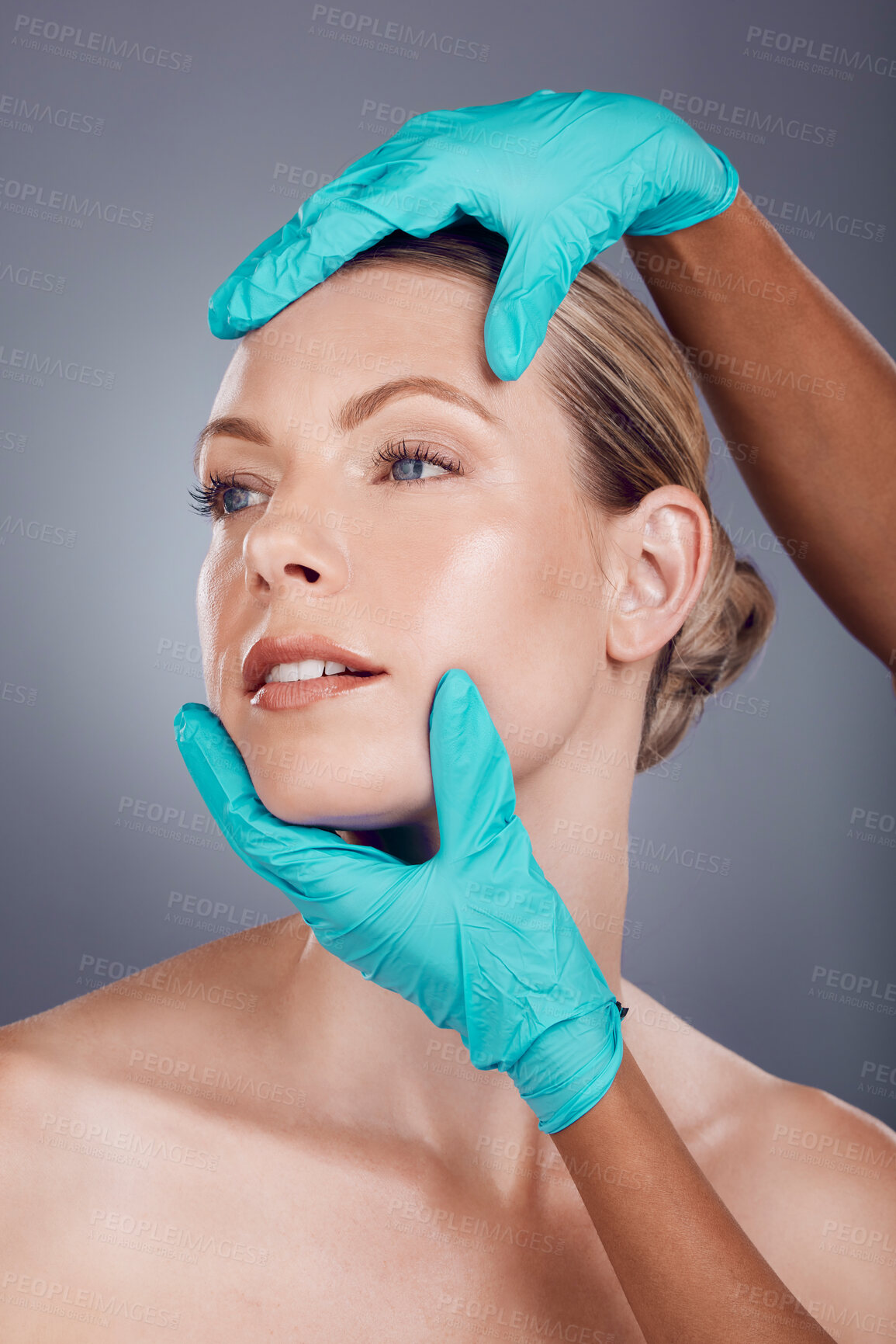 Buy stock photo Woman, studio and hands for plastic surgery, cosmetic transformation and beauty by gray background. Patient, anti aging consultation for collagen, skincare and aesthetic on face for change at clinic