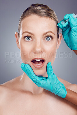 Injection, scared woman and face for skincare, collagen and beauty process in studio. Cosmetics, surprise portrait and needle for plastic surgery, botox facial change and aesthetic prp on background