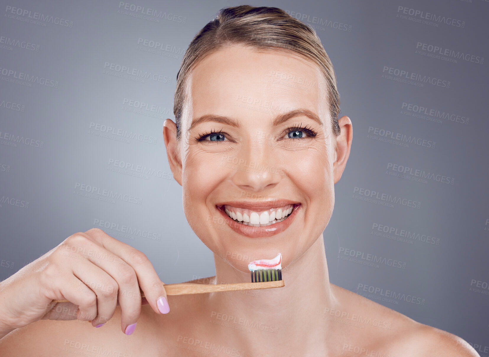 Buy stock photo Bamboo toothbrush, toothpaste and portrait of woman for dental wellness, healthy cleaning or face cosmetics. Happy female teeth, eco wooden brush and mouth of smile, mature model or studio background