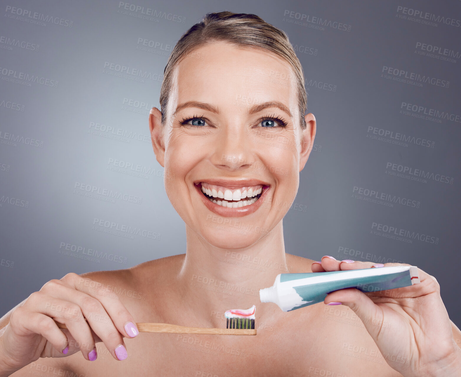 Buy stock photo Toothpaste, bamboo toothbrush and portrait of woman in dental wellness, healthy smile or eco cosmetics. Female model cleaning teeth with wooden brush, mature face or happy beauty on studio background