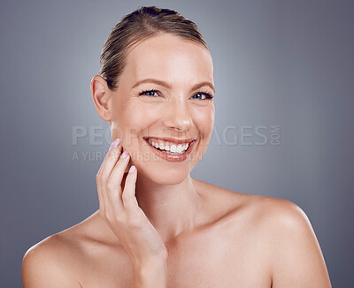 Buy stock photo Beauty, face and woman in portrait with hand touching facial, dermatology and skincare on studio background. Cosmetic care, happy model and healthy skin with smile, natural cosmetics and wellness
