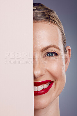 Buy stock photo Half, mockup and portrait of a woman with makeup isolated on a grey studio background. Space, cosmetics and face of a young, smiling and confident happy model with cosmetic glamour on a backdrop