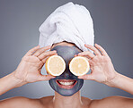 Lemon, face mask and woman cover eyes for healthy skincare, beauty and anti aging wellness makeup in studio. Happy female model, citrus fruits and vitamin c for aesthetic facial, shower glow or smile