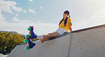 Peace, music and rollerblades with woman in skate park for summer break, streaming and sports. Fitness, relax and skating with girl listening to headphones in outdoors for hobby, freedom and health