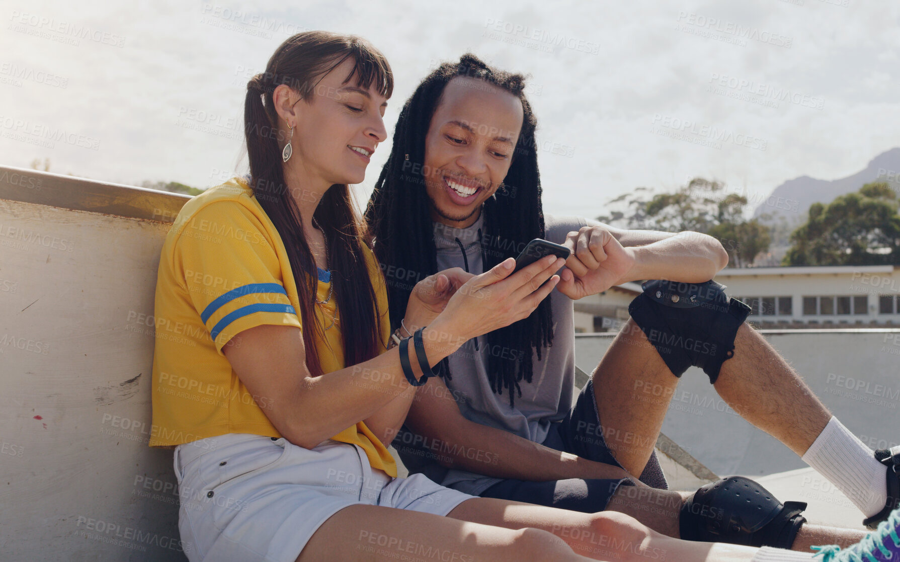 Buy stock photo Relax, phone and search with friends in skate park and sharing social media, news or communication. Technology, smile and internet with black man and woman in outdoors for message, mobile and website