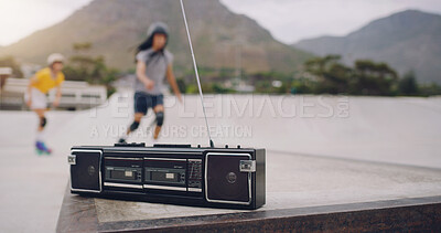 Buy stock photo Skate park, music and a retro radio outdoor for urban skating with people in blurred background. Freedom, cassette tape and energy for balance sports, action and training for fitness with audio sound