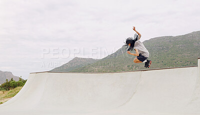 Buy stock photo Sports, roller skates and jump with black man in skate park for fitness, exercise and skating hobby mockup. Summer, wellness and action with skater in outdoors for training, cardio and stunt