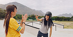 Laughing, funny and interracial couple bonding while roller skating and learning to click fingers. Playful, applause and woman clapping for a black man clicking while on skates at a park for fun