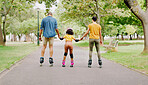 Family, park and holding hands to rollerskate with girl child with care, learning and support. Interracial parents, black man and woman with kid, back and helping hand on road for outdoor holiday