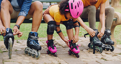 Family, children or rollerblade with a girl and parents in the park together for fun or recreation. Kids, love or learning with a mother, father and daughter bonding outdoor while rollerblading