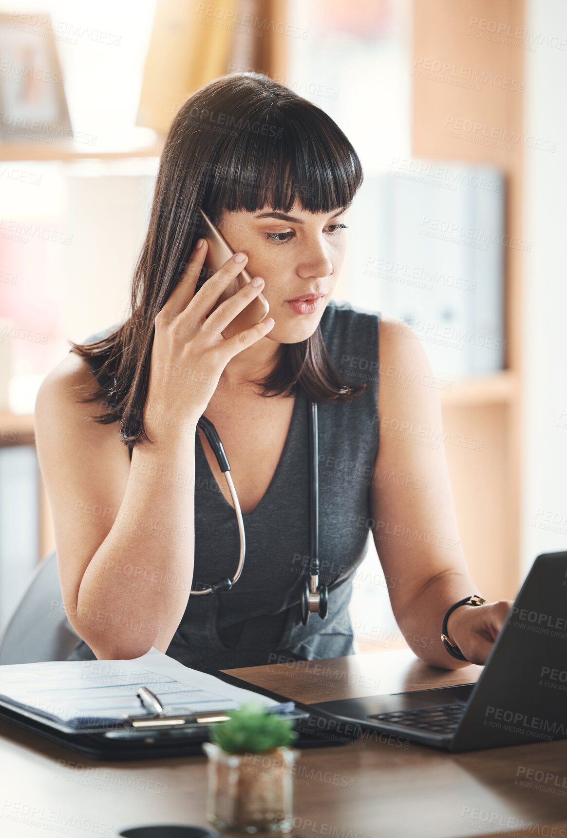 Buy stock photo Phone call, woman and doctor on laptop, talking or conversation in hospital clinic. Computer, healthcare and female medical physician with mobile smartphone for networking, telehealth or chatting.