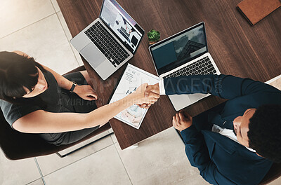 Buy stock photo Top view, handshake and partnership of business people in office for contract, deal or onboarding. Thank you, welcome and man and woman shaking hands for hiring, recruitment or teamwork, b2b or crm