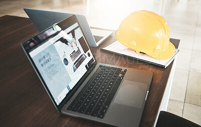 Buy stock photo Laptop, hardhat and desk in an industry office for engineering architecture project planning. Industrial, construction and computer or technology for research with a safety helmet in the workplace.