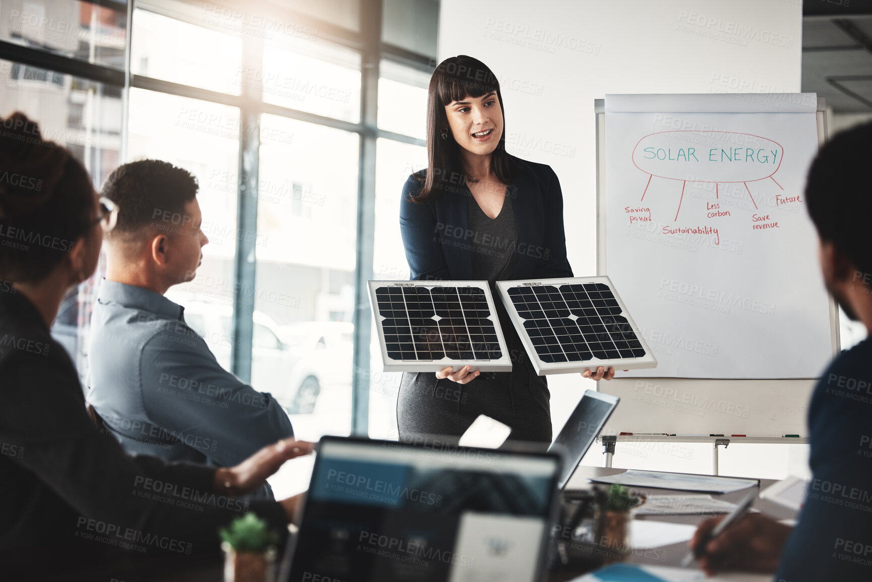 Buy stock photo Woman, solar panel and business presentation in office with investor group, ideas or future of earth. Innovation, renewable energy proposal or sustainability at workshop, brainstorming and teamwork