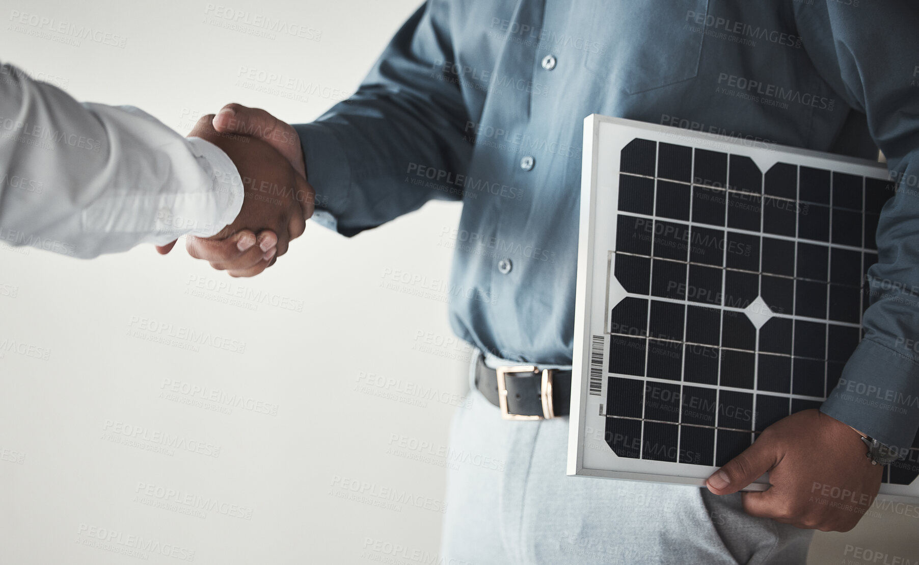 Buy stock photo Closeup, handshake and business with solar panels, mockup and partnership for sustainability. Zoom, men and employees with gesture for collaboration, eco friendly or energy for electricity or meeting