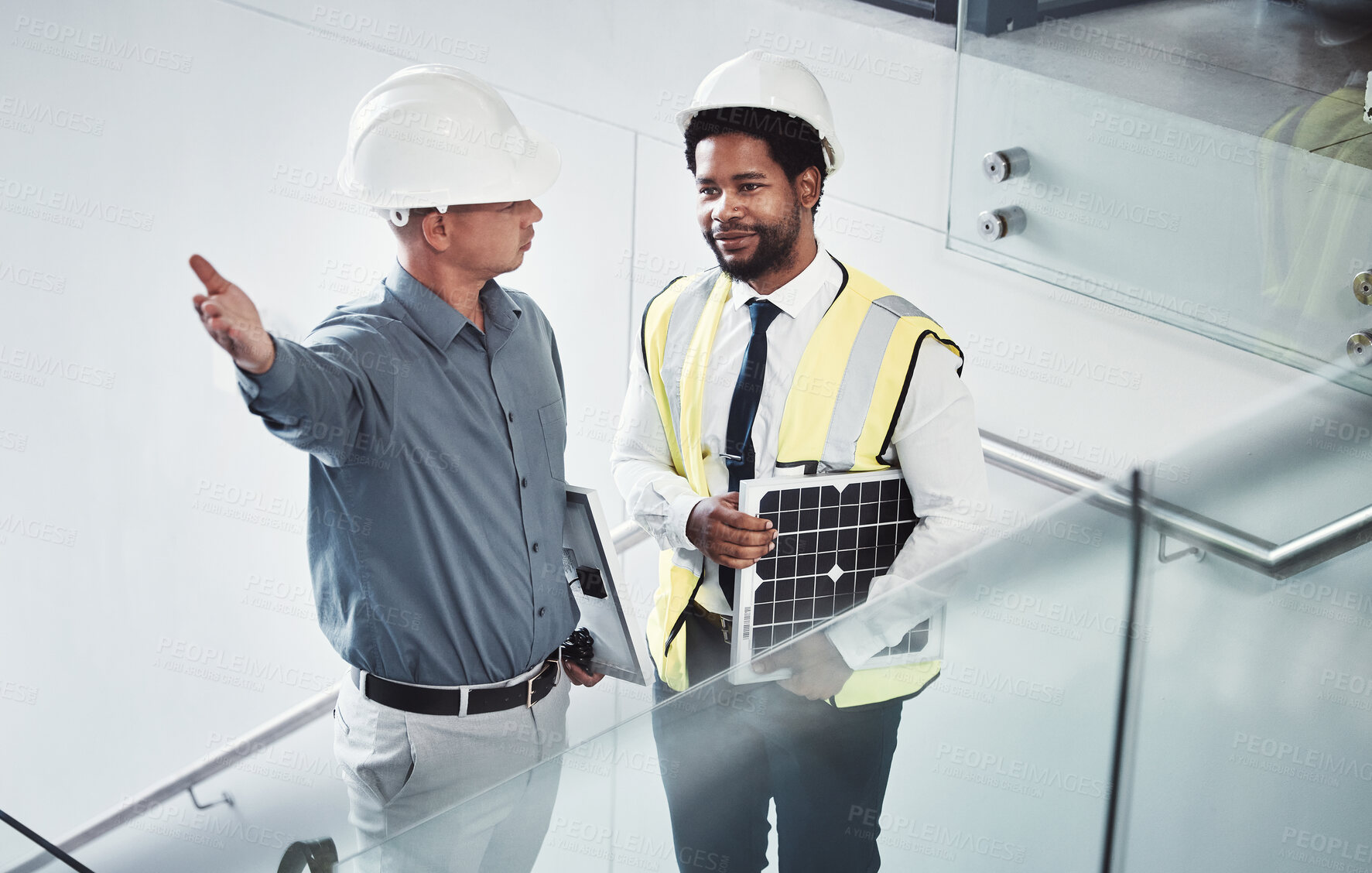Buy stock photo Engineer, electrician or team talking energy for construction project management. Diversity men together on office stairs planning collaboration strategy on engineering, solar panel power and vision