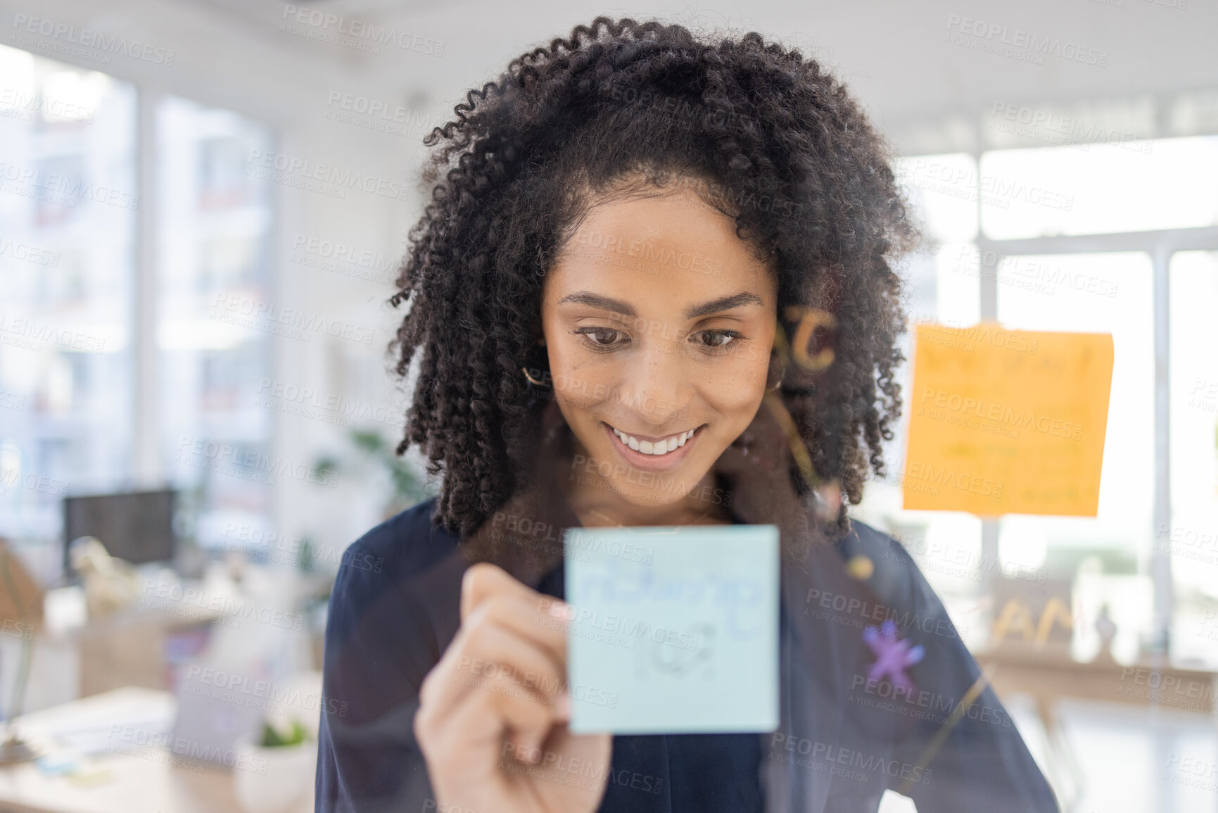 Buy stock photo Planning, thinking and writing by black woman in office for agenda, calendar or schedule on sticky note. Creative, strategy or lady with idea for future, vision or innovation, goal or problem solving