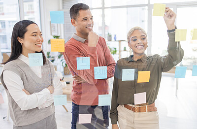 Buy stock photo Creative people, schedule and team in planning strategy or brainstorming on glass wall at office. Group in teamwork with smile for project plan, tasks and post it for sticky note or startup together