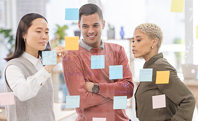 Buy stock photo Creative business people, schedule and team planning in strategy or brainstorming on glass wall at office. Group in teamwork for project plan, tasks and post it for sticky note or startup together