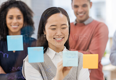 Buy stock photo Planning, writing and business people in office collaboration, teamwork or idea on sticky note. Asian leader woman, thinking and creative, strategy and problem solving by team with vision and goal