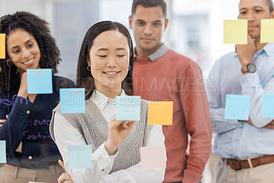 Buy stock photo Collaboration, writing and teamwork by business people in meeting for planning, idea and goal on sticky note in office. Team, schedule and diversity by group for mission, strategy or problem solving