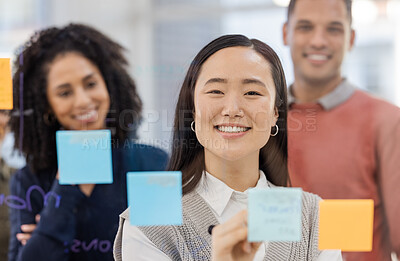 Buy stock photo Asian woman, portrait smile and writing schedule in planning, strategy or brainstorming on glass wall at office. Happy female designer in teamwork project plan, tasks or post it with sticky note