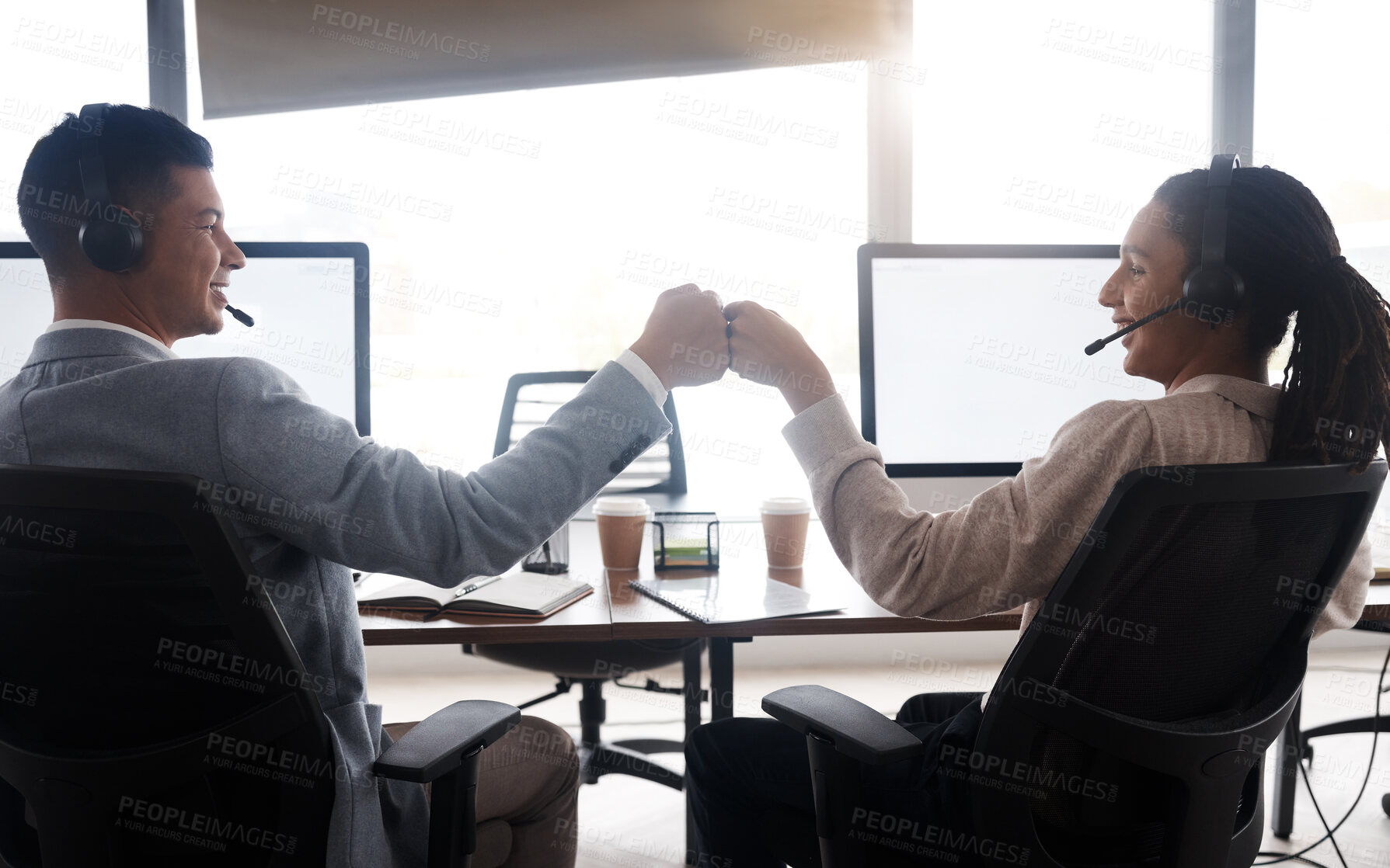 Buy stock photo Customer support fist bump, consulting and happy friends celebrate telemarketing goals on contact us CRM. Call center back view, ecommerce team solidarity or excited information technology consultant