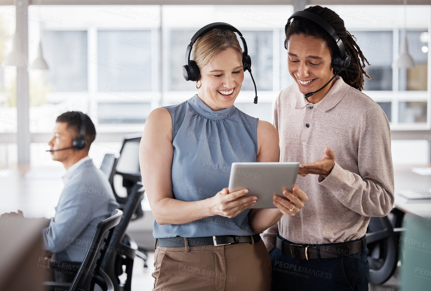 Buy stock photo Call center, customer support and consultants on a tablet in the office planning a crm strategy. Telemarketing, customer service and team of agents doing research on a mobile device in the workplace.