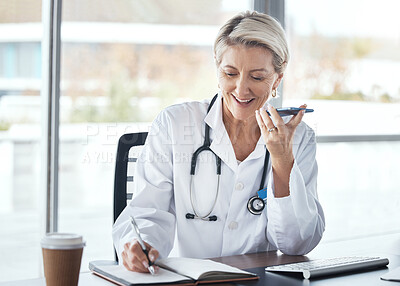 Buy stock photo Woman, doctor and speaker phone, call and schedule appointment with health, writing notes and confirm consultation. Communication, tech and healthcare, calendar and senior medical employee at clinic
