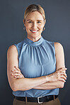 Portrait, smile and business woman with arms crossed in studio isolated on a blue background. Ceo, boss and happy, confident and proud female entrepreneur from Canada with vision and success mindset.