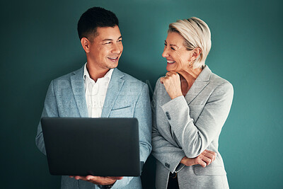 Buy stock photo Laptop, collaboration and planning with a business team in studio on a green background for strategy. Computer, teamwork or management with a man and woman working on growth as company leadership