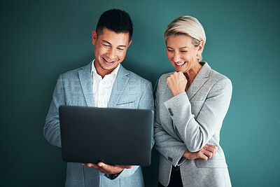 Buy stock photo Laptop, collaboration and strategy with a business team in studio on a green background for planning. Computer, teamwork or management with a man and woman working on growth as company leadership