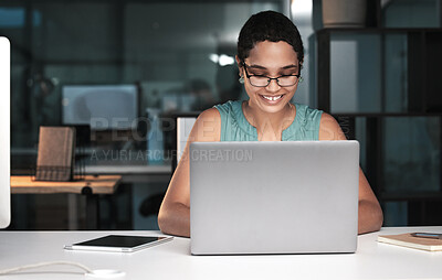 Buy stock photo Office laptop, happy woman and night work on overtime article for social media app, digital website or online blog. Employee inspiration, reading internet info and African journalist typing news post