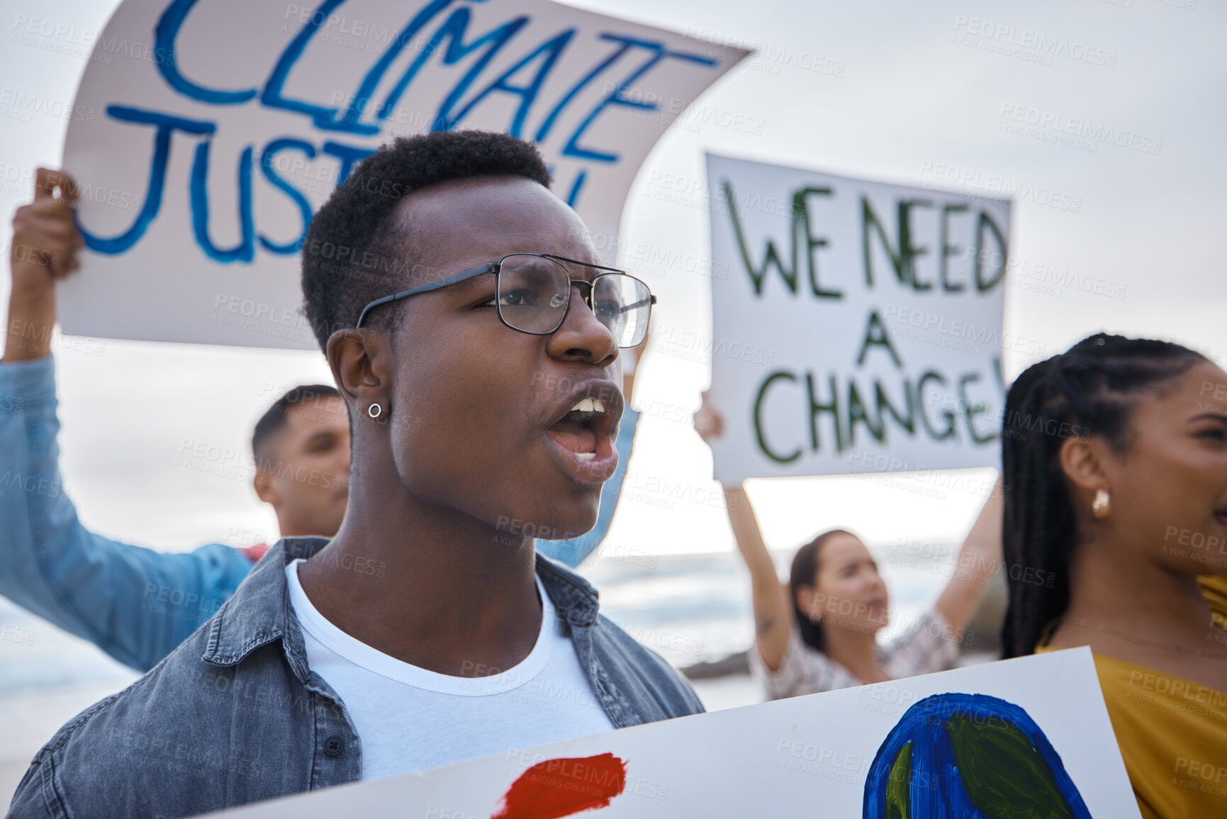 Buy stock photo Climate change, sign and black man profile with megaphone for freedom movement. Angry, crowd screaming and young people by the sea with world support for global, social and equality action at ocean