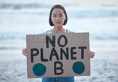 Buy stock photo Protest, planet earth and woman with a sign for climate change to stop pollution and global warming at beach. Political, nature activism and portrait of Asian female with board by ocean for march
