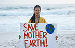 Save earth, sign and woman portrait at beach for pollution, environment and green planet protest. Ocean, sea and nature globe poster or cardboard for awareness, global warming and climate change