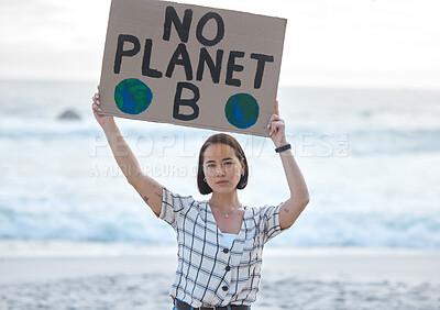 Buy stock photo Protest, climate change and woman with a sign on the beach to stop pollution and global warming. Political, earth activism and portrait of a Asian female leader with a board by the ocean for a march.