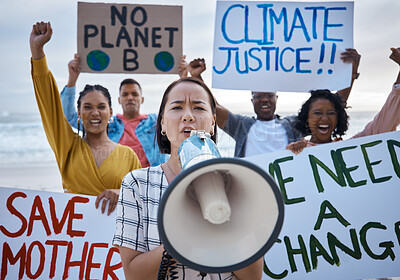 Buy stock photo Climate change protest, megaphone and Asian woman with crowd at beach protesting for environment, global warming and to stop pollution. Save the earth, portrait and female leader shouting on bullhorn