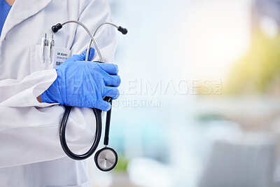 Buy stock photo Doctor, hands and stethoscope with arms crossed on mockup for healthcare, life insurance or service. Hand of medical expert GP with latex gloves in cardiology for advice, help or medicare assurance