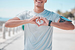 Fitness, hands in heart and man with smile ready to start workout, training and cardio exercise. Sports, motivation mindset and male athlete in Miami for body wellness, healthy lifestyle and running