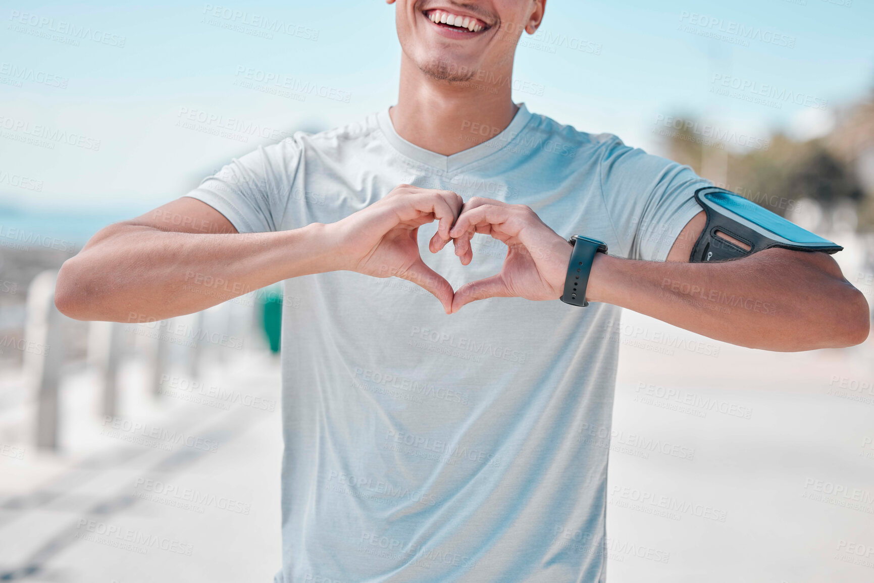 Buy stock photo Fitness, hands in heart and man with smile ready to start workout, training and cardio exercise. Sports, love and male runner with shape in Miami city for wellness, healthy lifestyle and motivation