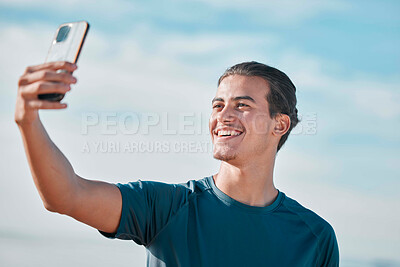 Buy stock photo Fitness, man and exercise selfie on outdoor for social media, profile picture and workout vlog post. Sports person, runner and photograph with smile on blue sky, wellness goals and running motivation