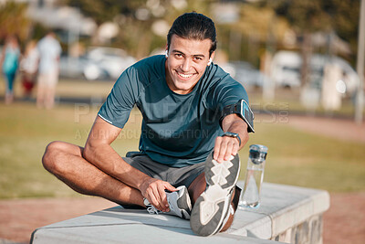 Buy stock photo Fitness, portrait and man doing a stretching exercise before running or training for a marathon in a park. Sports, health and male athlete doing leg warm up before an outdoor cardio workout in field.