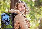 Woman, hiking portrait and forrest with smile for freedom, peace and outdoor adventure for exercise. Gen z explorer girl, face and happiness for fitness, wellness and mindset in woods on summer walk