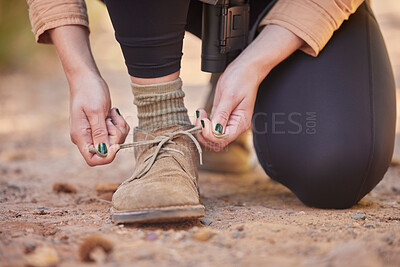 Buy stock photo Shoes, hiking and woman tying laces to start a walk, adventure or trekking in nature of Norway. Ready, active and feet and hands of a girl walking on ground in the mountains for exercise and cardio